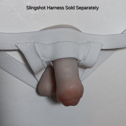 Close-up of a 2 inch STP Skin in a white slingshot harness with text indicating it is sold separately.