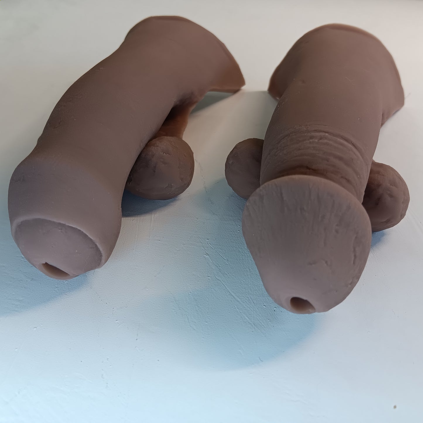 Image showing the circumcised and uncircumcised 5 inch STP Skins from the point of view looking at the tip.