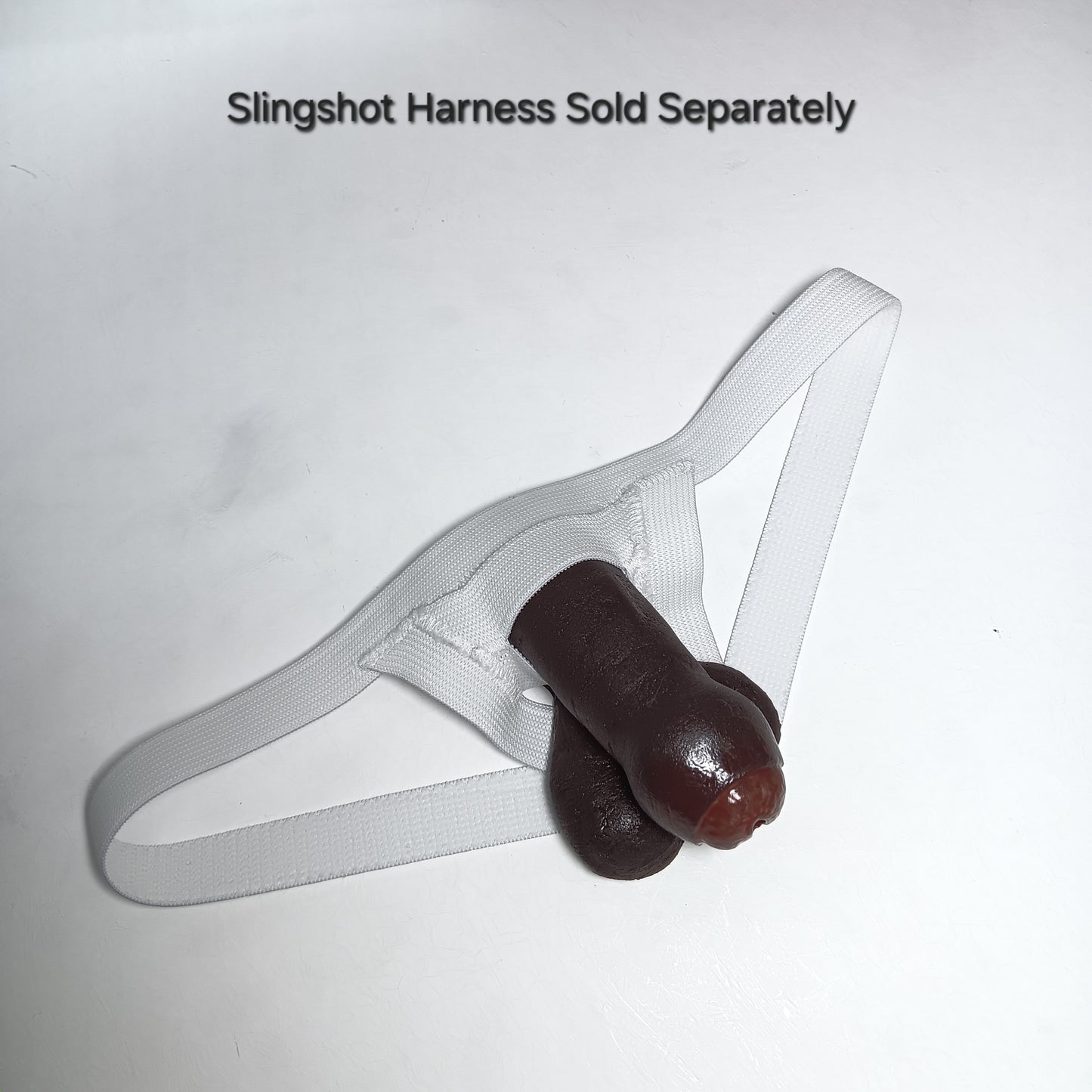 Color #8 Uncut 3 inch STP Skin in white fitted Slingshot Harness with text 'slingshot harness sold separately' 