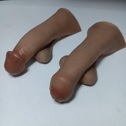 Photo of two styles of STP Skins shown- silicone lifelike circumcised and uncircumcised FtM gender affirmation prosthetic.