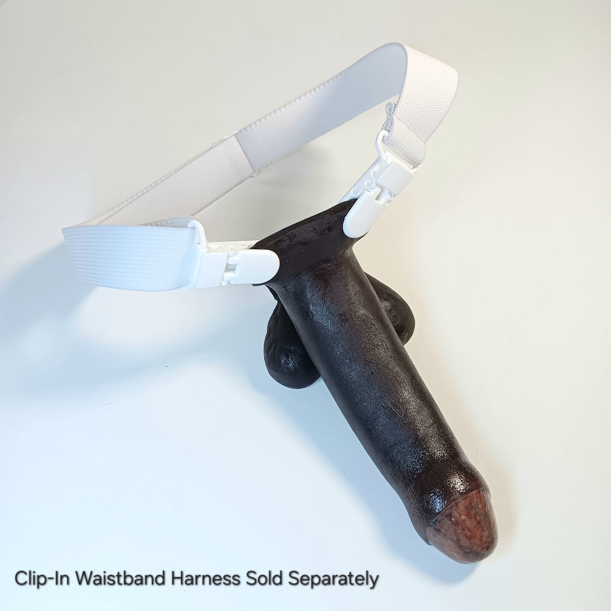 5 inch Action Toy in a Clip-In Waistband Harness.  Text reads 'Clip-In Waistband Harness Sold Separately'