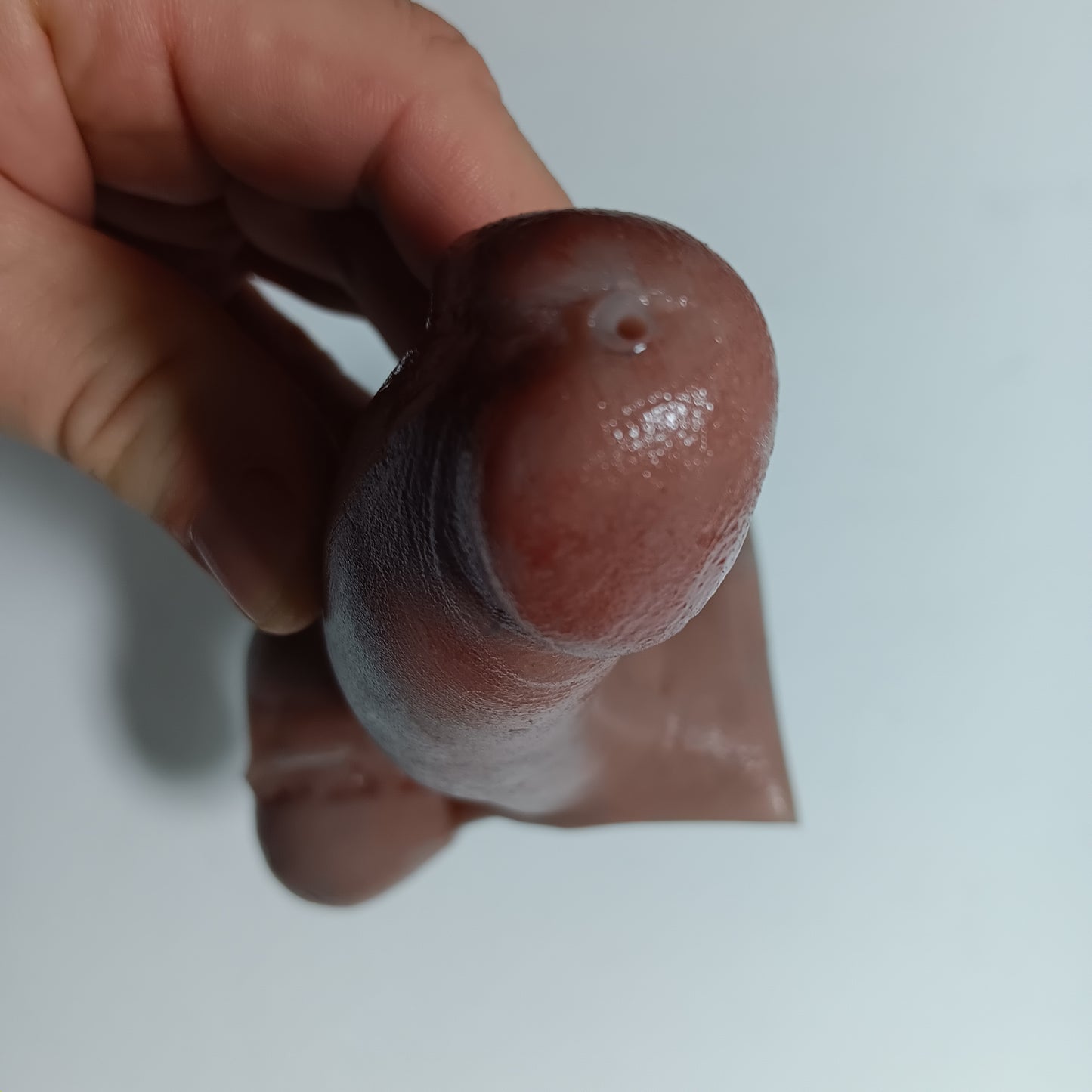 Close up of the 5 inch B.J.E.J. showing the small suction/ejection hole in the tip of realistic prosthetic.