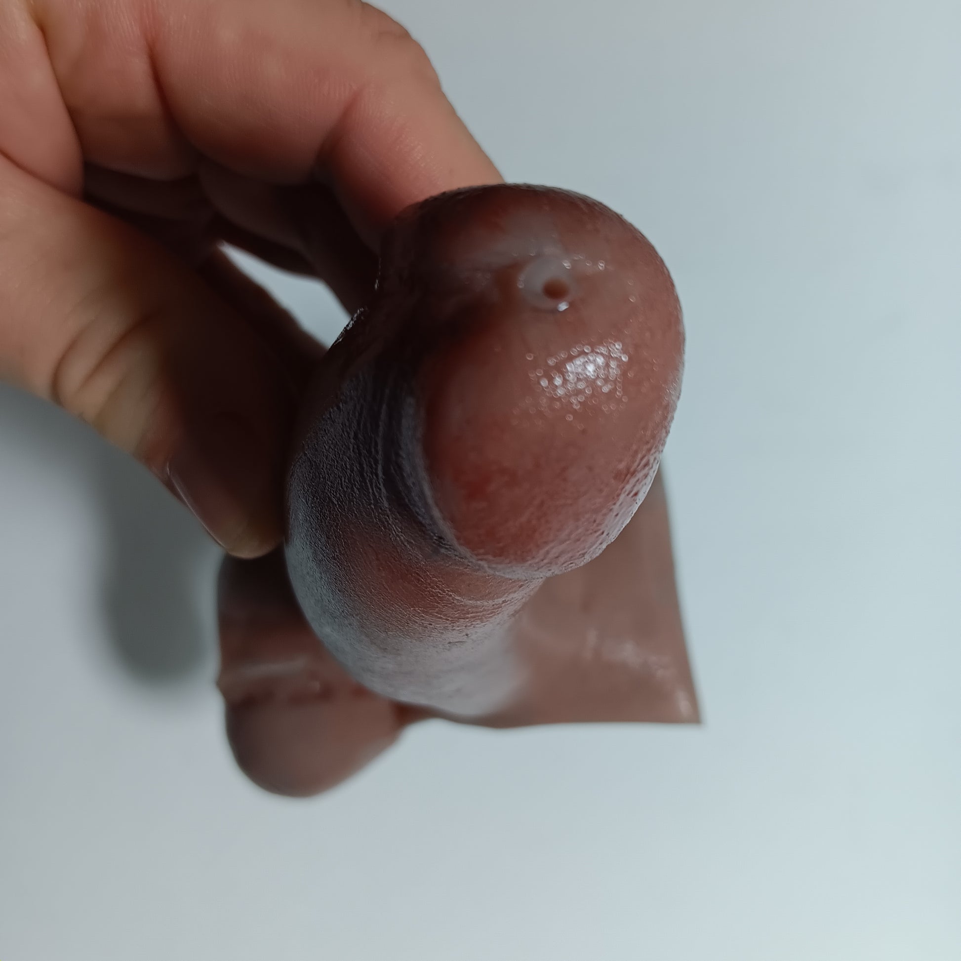 Close up of the 5 inch B.J.E.J. showing the small suction/ejection hole in the tip of realistic prosthetic.