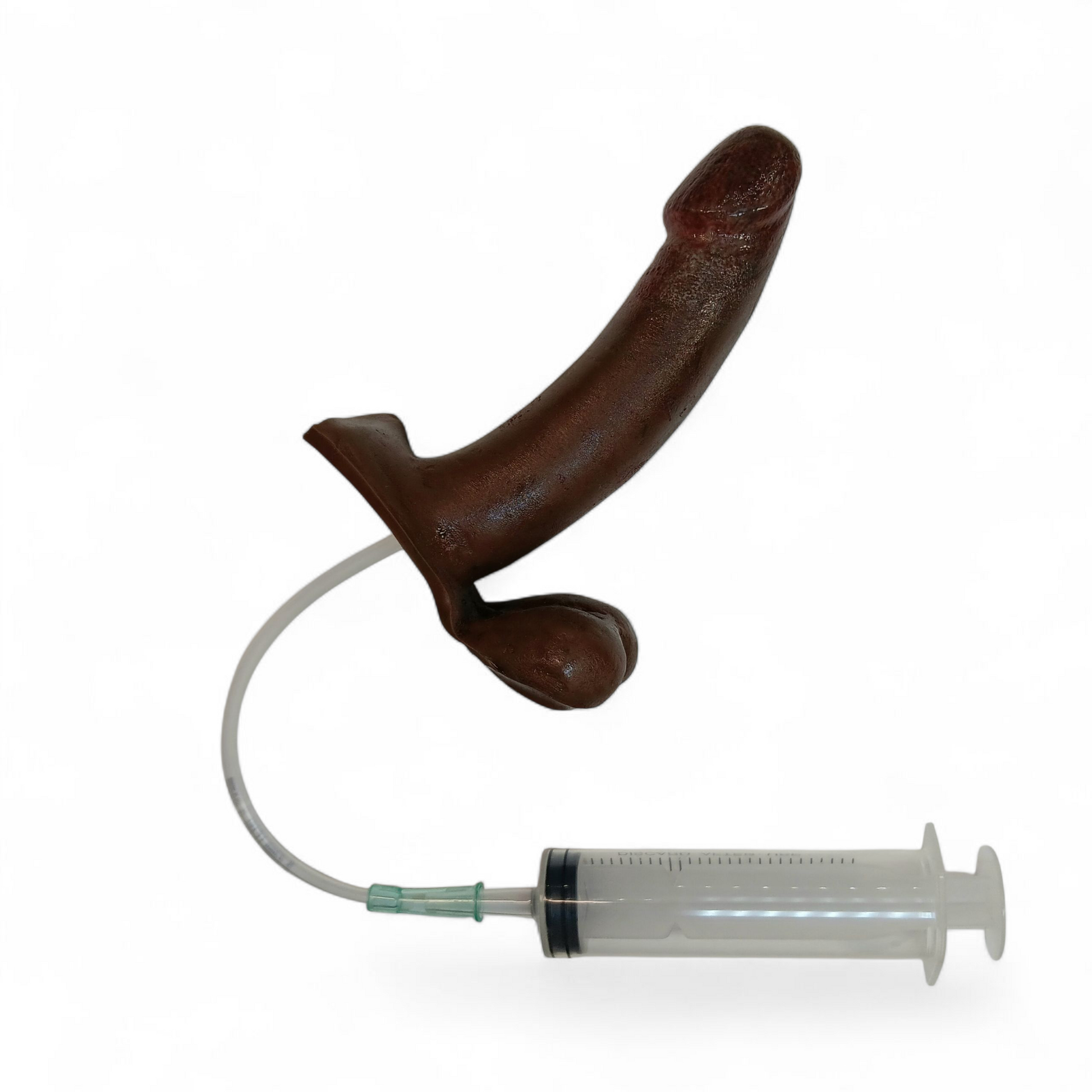 A 5 inch B.J. Eject with syringe and tubing