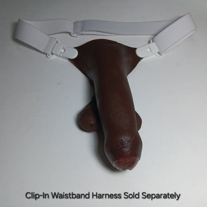 Showing the 5 inch STP Skin with realistic full paint uncircumcised color number 8 in a white adjustable clip-in waistband harness.