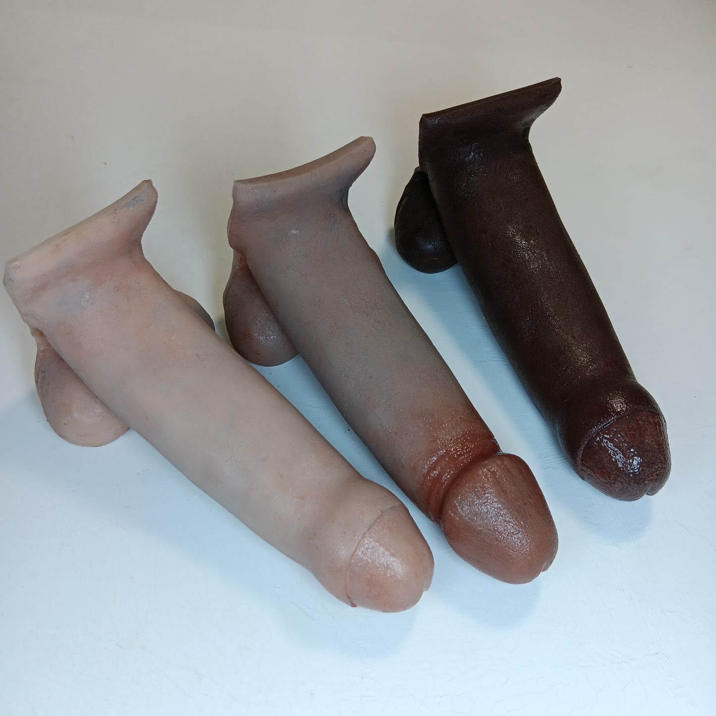 A small color sample of 3 6 inch Action Toys on a white background.  Showing realistic finish on a variety of skin tones.