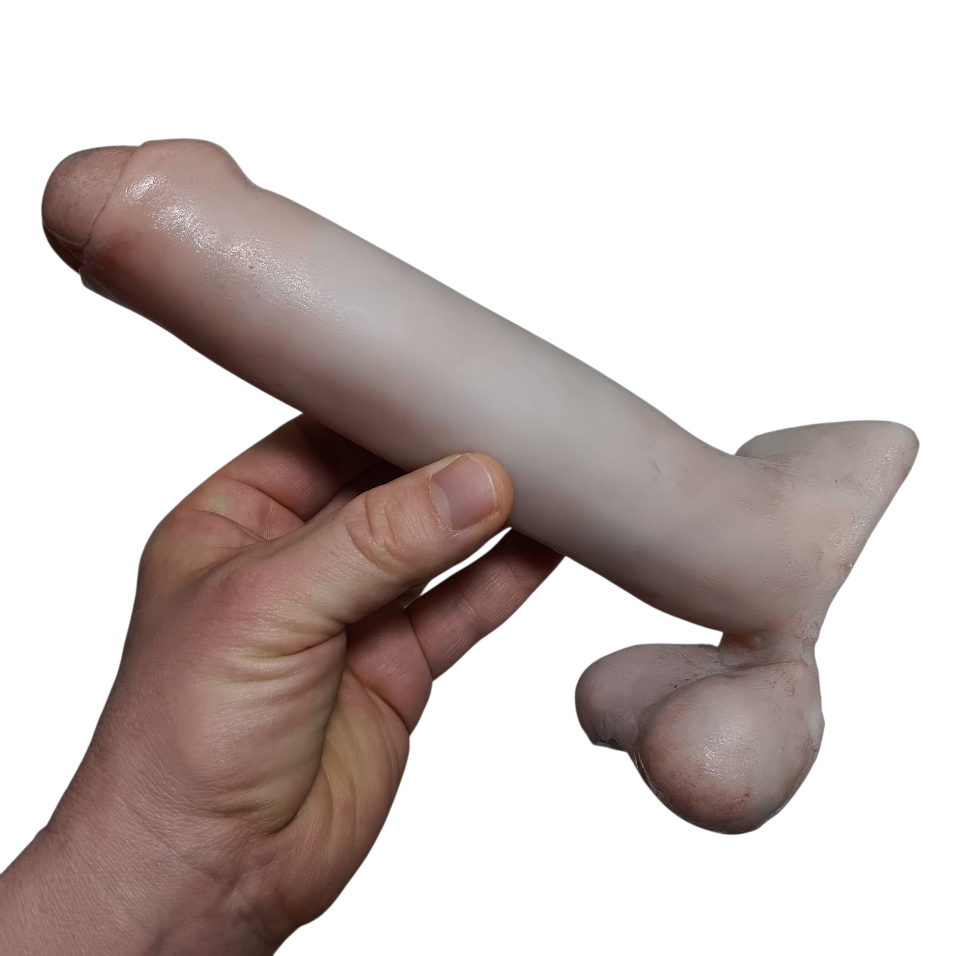 7 inch SQUEEZE Action Toy by Number One Laboratory in hand on white background.