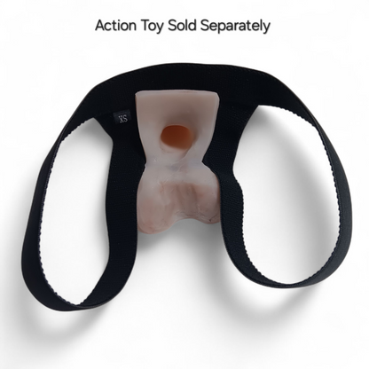 Showing the inside of the Sling Shot Fitted harness with the Squeeze Action Toy inside.  The sling shot harness has 2 elastic straps that loop around each thigh, the Action Toy sits in the center.  The backside of the toy is hollow to provide suction.