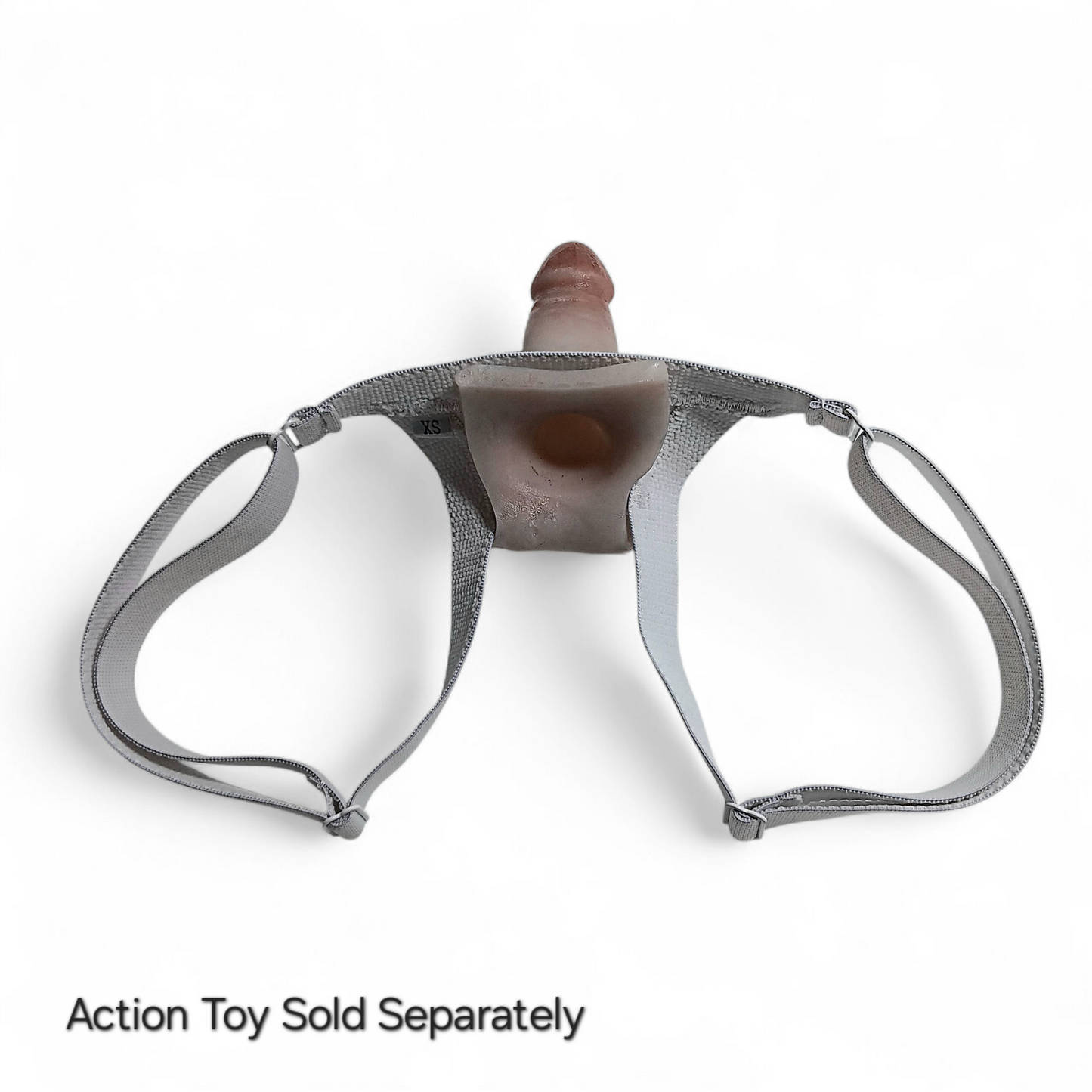 Showing the backside of the Slingshot harness with an Action toy holstered in it.  You can see the suction hole in the base of the Action toy for wearer suction.