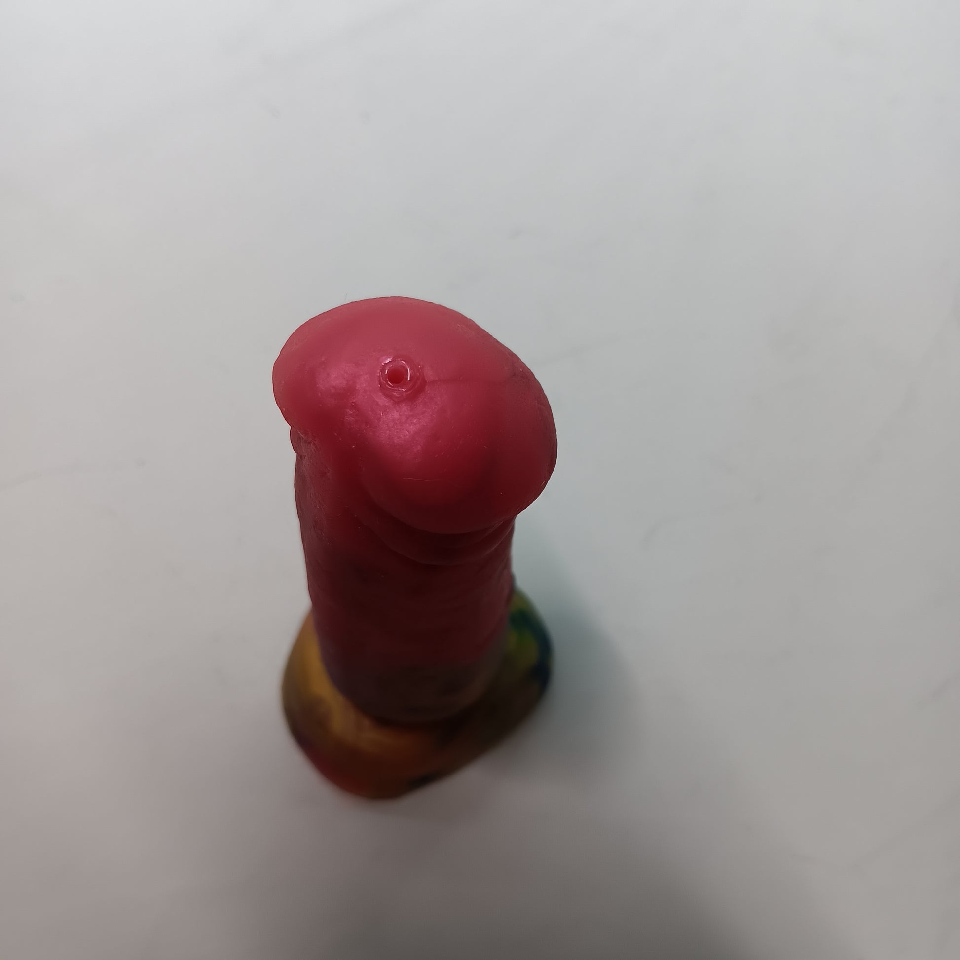 Top view of B.J. dildo showing the small hole in the tip to provide suction. 