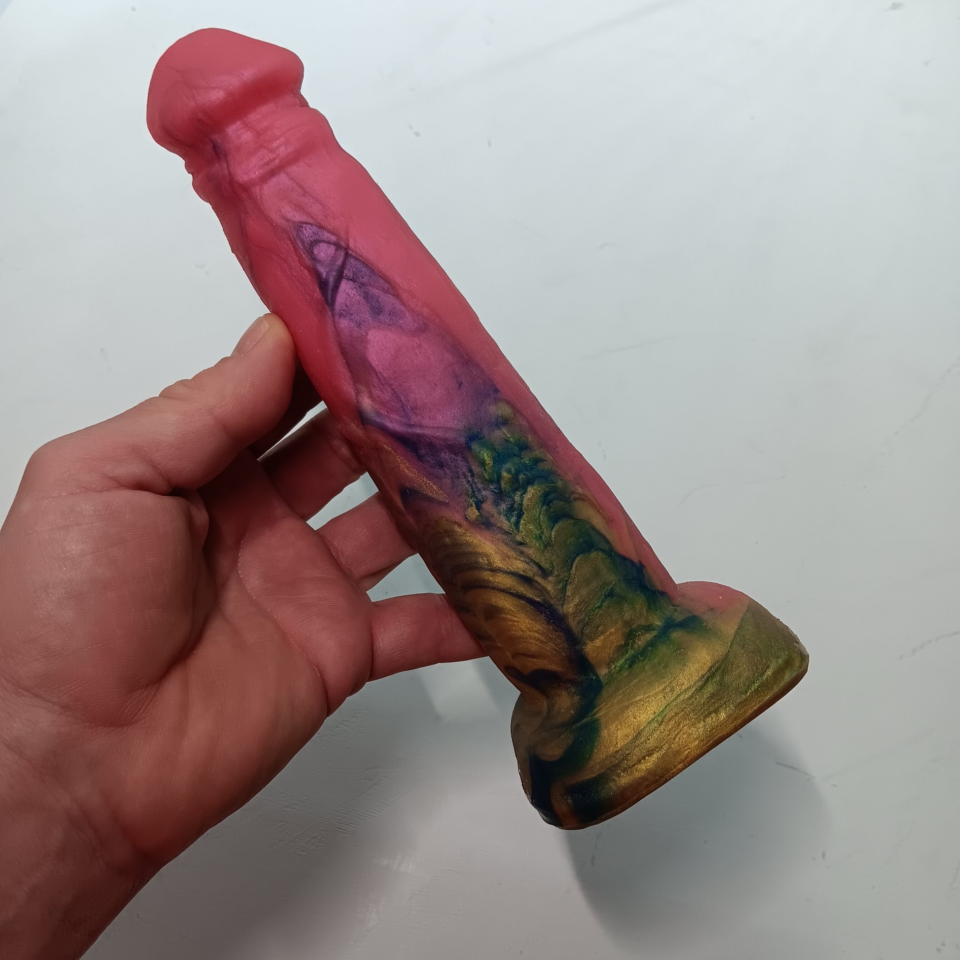 Front side of the Pink, gold, dark blue BJ showing swirls and beautiful patterns in platinum Silicone