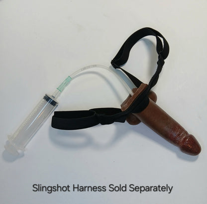 A top down view of the 5 inch B.J. E.J. in a black Adjustable Harness with syringe.